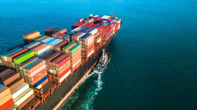 Container ship carrying recyclable fibre across export lanes